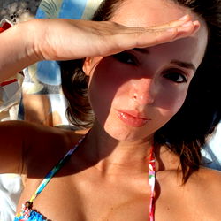 J, a stunning beach model with a vibrant personality