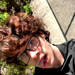 A Person with Glasses Taking a Selfie