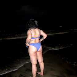 JJ, a beautiful OnlyFans model posing on the beach at night