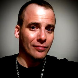 Man in Black T-Shirt and Chain Necklace