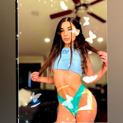 Model Showcasing Bikini in Playful Setting