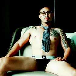 Shirtless Model Posing with Tattoo