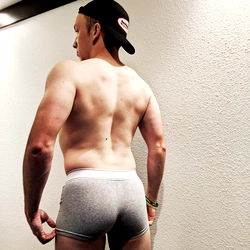 AlphaAbs: A Shirtless Model Striking a Pose