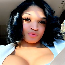 Pinkk from OnlyFans poses in blue car for photoshoot