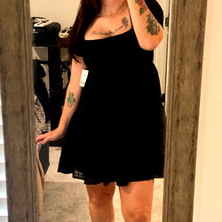 Mia, OnlyFans Model Showcasing Style in Casual Dress