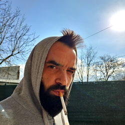 Urban Smoker in Grey Hoodie