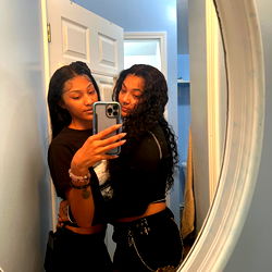 A Stylish Mirror Selfie in a Bathroom with One Female Model