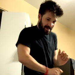 A young man in a black shirt dancing