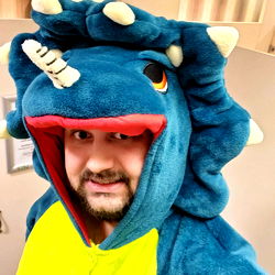 Funny photo of a man in a dinosaur costume