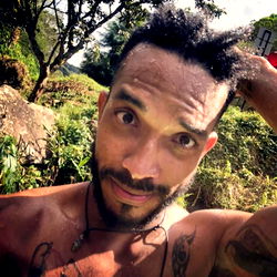 Young Man with Tattoos in Nature