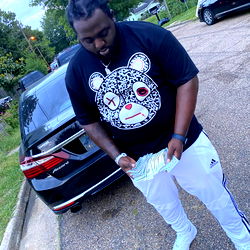 A Man in a T-Shirt and Cap