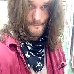 Man with Long Hair, Bandana, and a Flannel Shirt