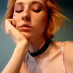 Aurora, a Female Model with Red Hair and Pink Tie