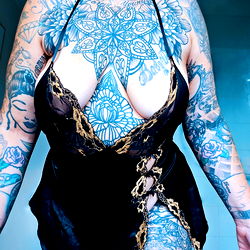 Full-body Photo of a Woman with Tattoos in a Rooftop Setting, 30 Years Old