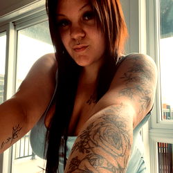 Cochonne2.0, Tattooed Woman with Long Hair Taking a Mirror Selfie