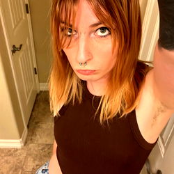 Colorado-Based Model Adora, Captured in Stylish Tank Top and Short Hair