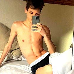 Shirtless Model Posing for a Selfie