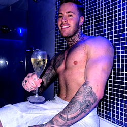 Man in a Bathroom with Wine Glass