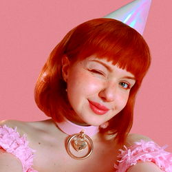 LilSlvKitten, a striking red-haired OnlyFans model