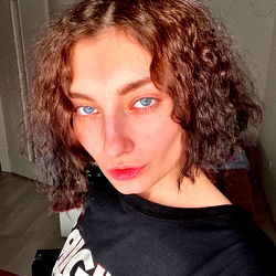 Young Woman with Short Hair and Blue Eye Makeup