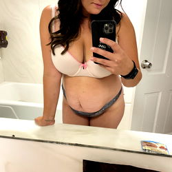 Mari, an OnlyFans model, captured in a bathroom snapshot