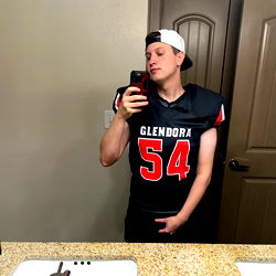 A Young Man Standing in a Kitchen.