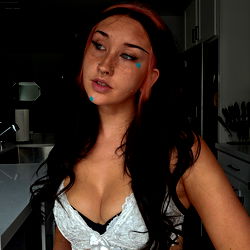 Baby Bear, a young model with striking eyes and pink hair