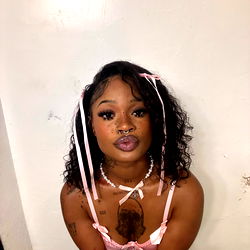 Alice, an OnlyFans model posing in a suggestive manner