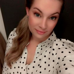 A Model in a Dotted Blouse and Polka Dot Background