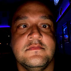 A Man Taking a Selfie with Unusual Expression