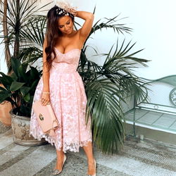 Stylish Andrea in a Pink Dress, Posing at an Event