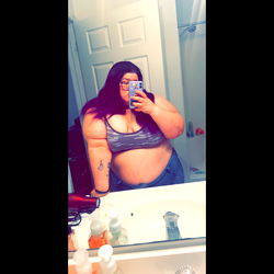 Ash, an Evansville-based OnlyFans model captures her form in a mirror selfie.