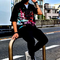 Stylish Model Posing on Rail in Urban Environment