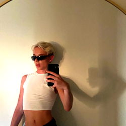 Aden ੈ✩‧₊˚ in a minimalist pose