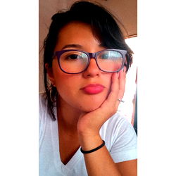 Adri, a young woman with glasses