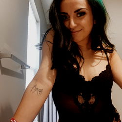 Alex, a striking model pose for the camera in a unique outfit