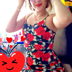 Stylish Woman in Red Floral Swimsuit Posing for Selfie