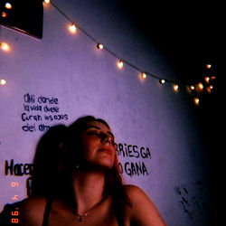 Model Abby in a dimly lit room