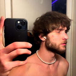 Pyrex Model, Shirtless Selfie with Tattooed Arm and Necklace