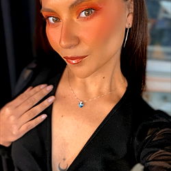 Model posing in front of camera