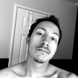 Shirtless Man Taking Selfie