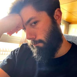 Emotional Man with Beard Sitting, Portugal