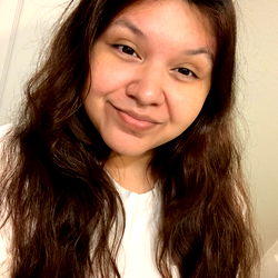 A Person with Long Hair Smiling