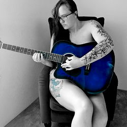 OnlyFans model Alice May with guitar