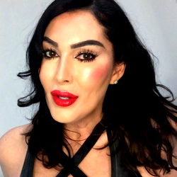 Fashionista TS Amanda Lorian, a striking image of a model in a leather strap top