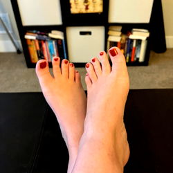 Alessandra Y's Feet Resting on a Table