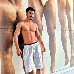 Persian Model Posing with Artistic Posters