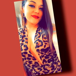 Babyluv, a captivating OnlyFans model with cheetah print dress and leopard print background
