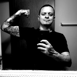 Brian Manning, Tattooed and Muscular Man from Indiana, Flexing in Bathroom Mirror