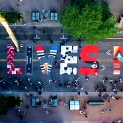 Festival-themed sign with model name and photo